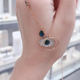 Evil Eye Necklace with Blue Crystal and Key Design