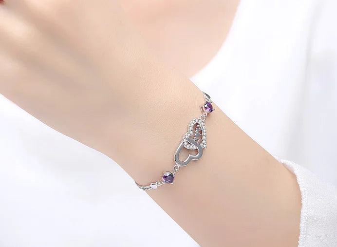 Pulsera de plata 925 con doble corazón de cristal y circonitas