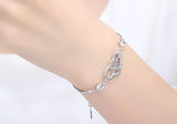 Pulsera de plata 925 con doble corazón de cristal y circonitas
