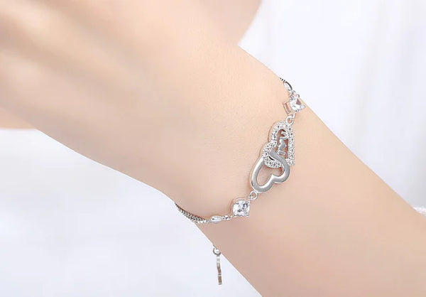 Pulsera de plata 925 con doble corazón de cristal y circonitas