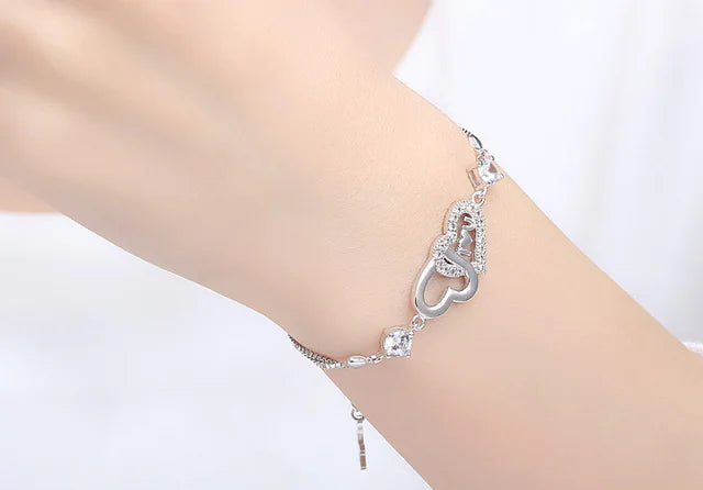 Pulsera de plata 925 con doble corazón de cristal y circonitas
