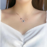 Evil Eye Necklace with Blue Crystal and Key Design